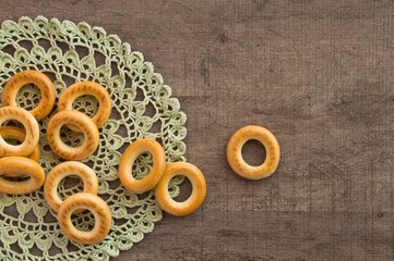 traditional bagels and lace doily on a wooden table