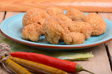 meat chop on blue plate with red pepper