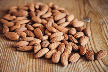almonds on wooden surface