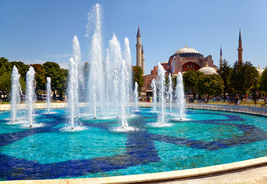 The fontain  in Sultan Ahmet Park with Hagia Sophia in the backg