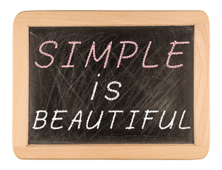 Simple is beautiful words written on blackboard