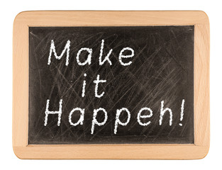 Make It Happen written in chalk on a used blackboard. Used in bu