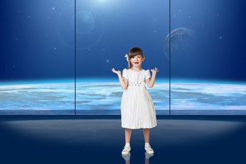 Little girl in front of the window