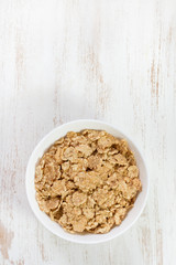 cereals in white bowl on white background