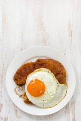 alheira with egg on plate