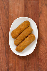 meat croquete on white dish