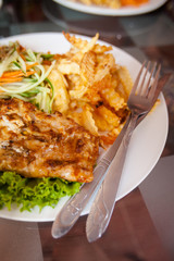 Cambodian fish barbeque with fries