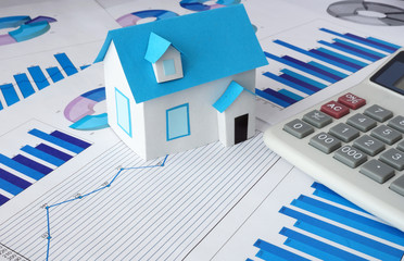 Model  house for sale and graphs. Real estate