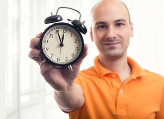 man with alarm clock