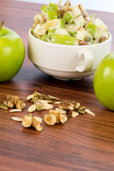 apple salad with almonds, walnuts and pumpkin seeds