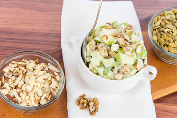 apple salad with almonds, walnuts and pumpkin seeds