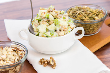 apple salad with almonds, walnuts and pumpkin seeds