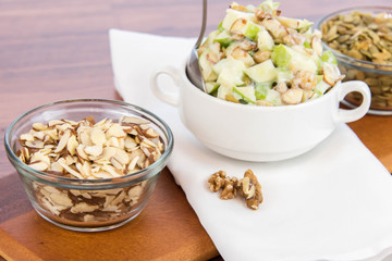 apple salad with almonds, walnuts and pumpkin seeds