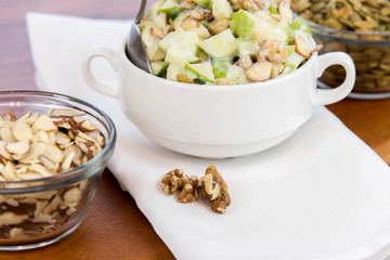 apple salad with almonds, walnuts and pumpkin seeds