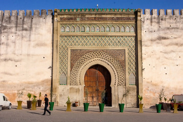very old wooden gate to the medina, Meknes, Morocco - obrazy, fototapety, plakaty