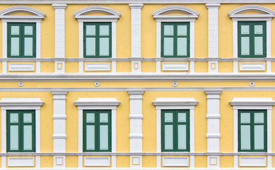Fototapeta na wymiar pattern green vintage style window on yellow wall