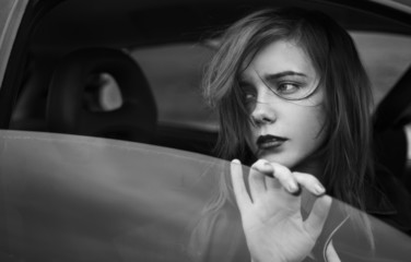 pretty girl looking out the car window