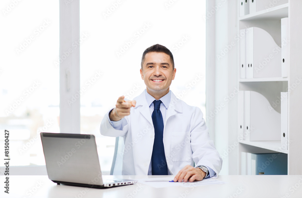 Canvas Prints smiling doctor pointing finger at you in office