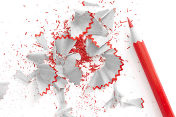 Sharpened pencil and shavings. Red, black and white colors.