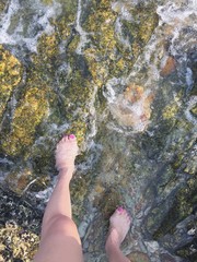 feet on the rock,wave. 