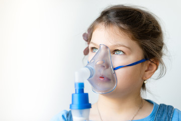 girl with asthma / allergy inhaler - inhalation mask