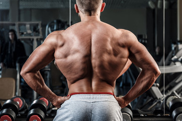 Young man showing his muscular back