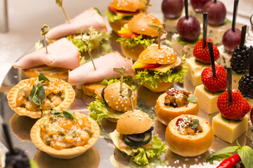 Canapes of cheese vegetables meat and seafood