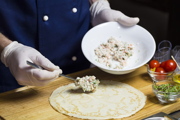 cook prepares canapes in the kitchen at the restaurant