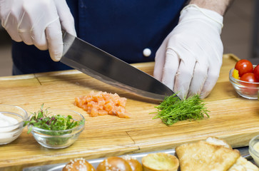 cook prepares canapes in the kitchen at the restaurant