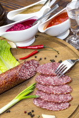 sausage on a wooden plate in a restaurant