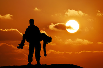 silhouette of a soldier officer man holding on hands girl woman