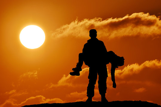 silhouette of a soldier officer man holding on hands girl woman