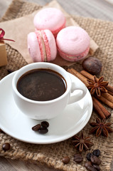 cup of hot coffee and spices, macaroons