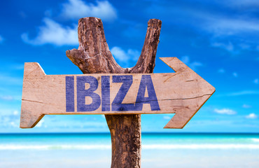 Ibiza wooden sign with beach background - obrazy, fototapety, plakaty