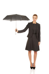 Businesswoman holding an umbrella.