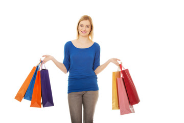 Woman with a lot of shopping bags.