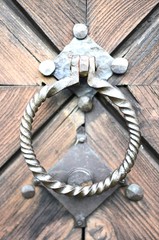 Fototapeta na wymiar Ancient knocker on the door