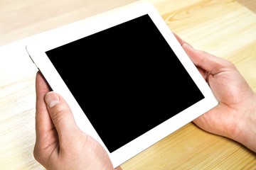 Tablet. Woman hand touch white tablet with blank empty screen