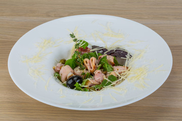 Rucola with squid salad