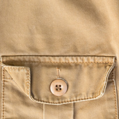 front pocket on brown shirt textile texture background