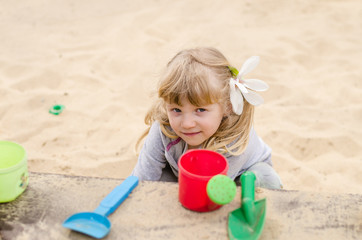 child playing with sand
