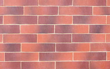Wall of red decorative bricks.