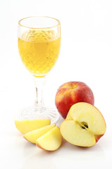 Apple juice with slice of apple on white background