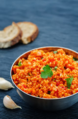 millet porridge with tomato sauce, garlic and parsley