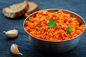 millet porridge with tomato sauce, garlic and parsley