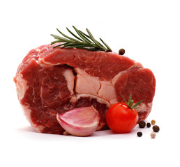 Huge raw ribeye steak garnished with spices