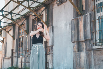 Beautiful brunette posing in an industrial context