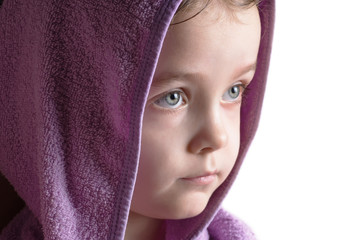 Girl head portrait wearing bathrobe hood staring right