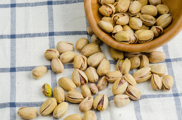 roasted and salted pistachios on table cloth