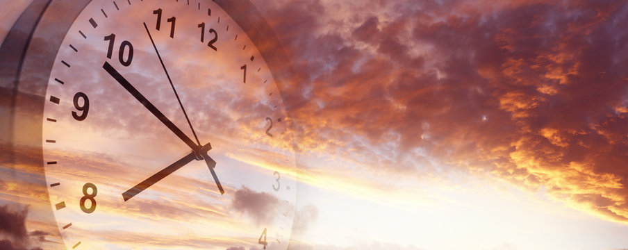 Time passing. Clock in sky